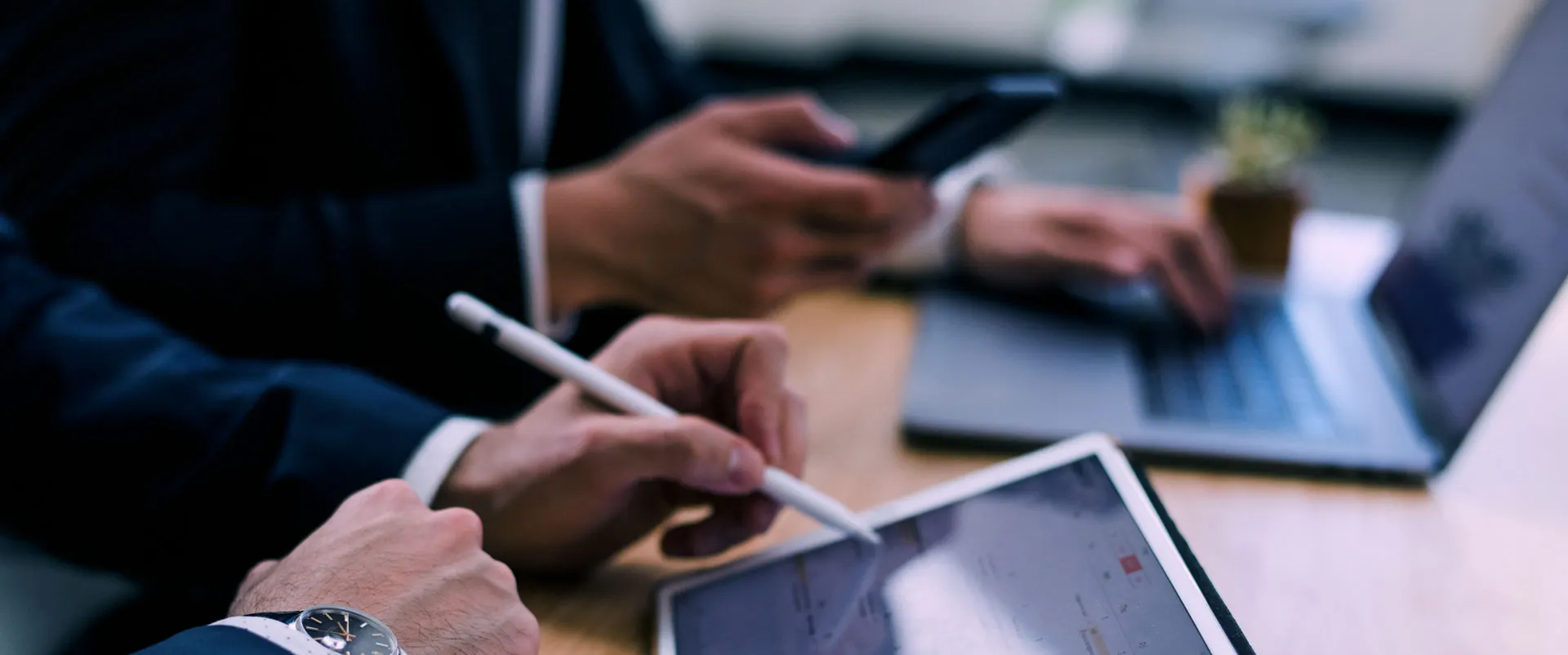 Business professional working at a laptop and tablet